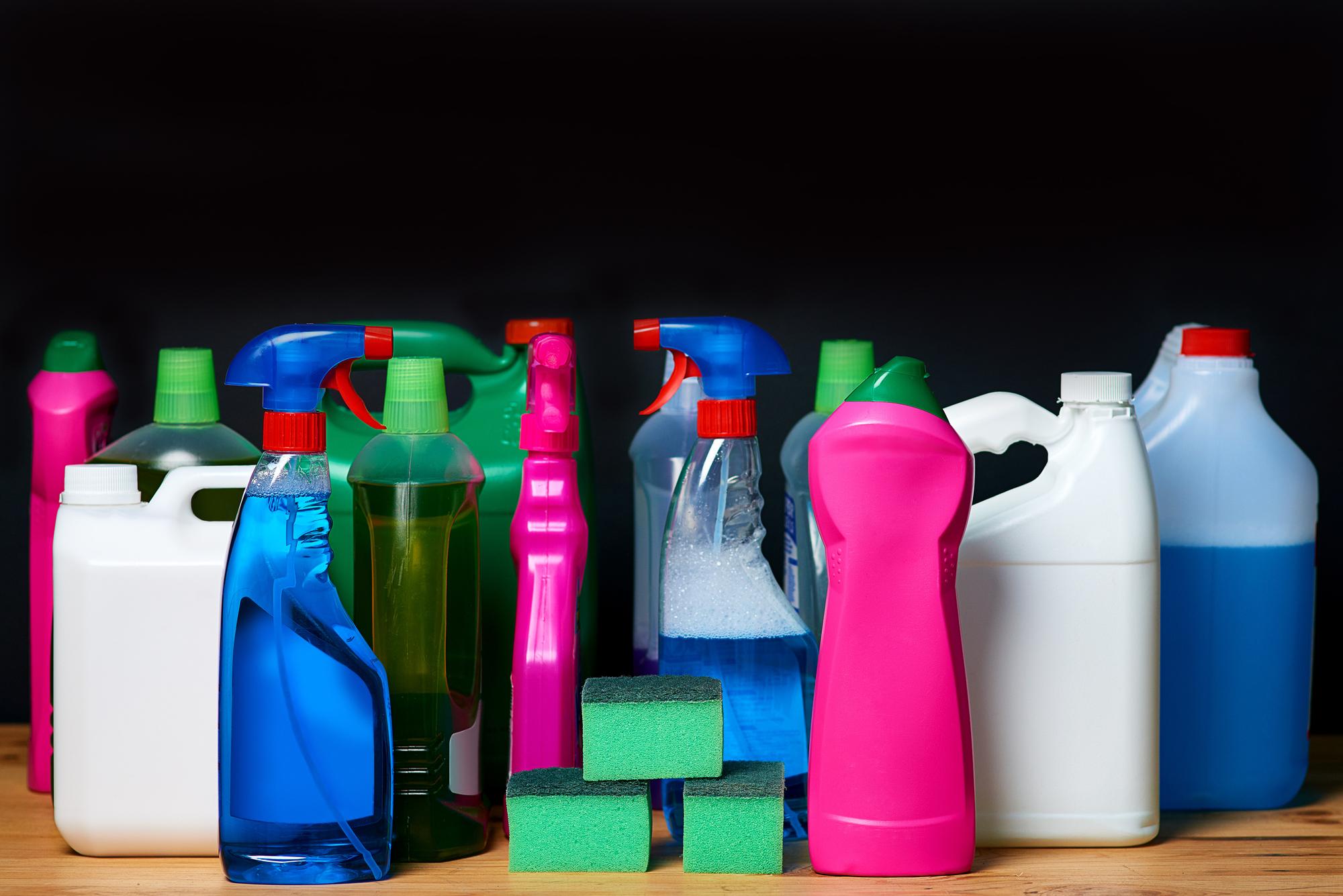 cleaning-equipment-shot-various-bottles-detergents-isolated-black_590464-38964